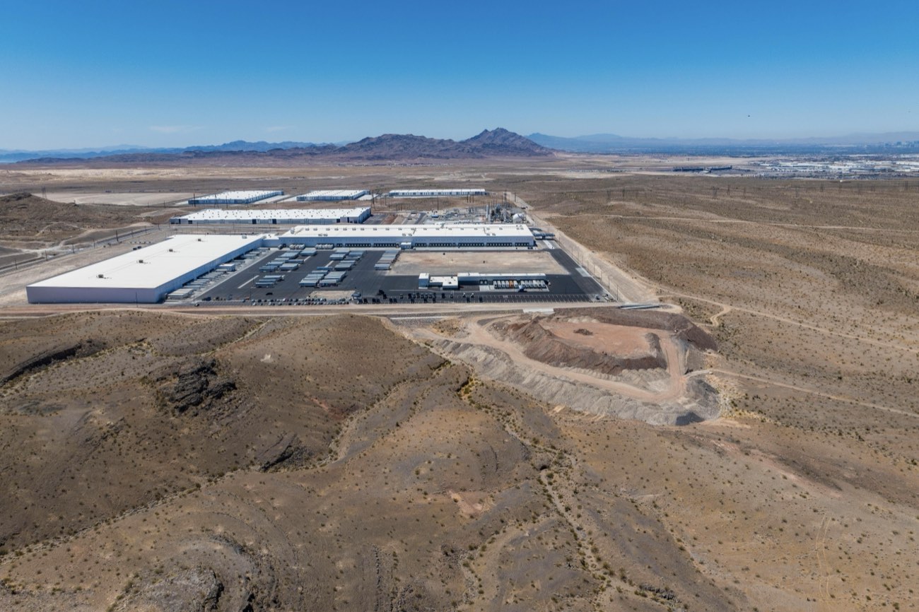 Land parcel aerial context perspective with mountain backdrop