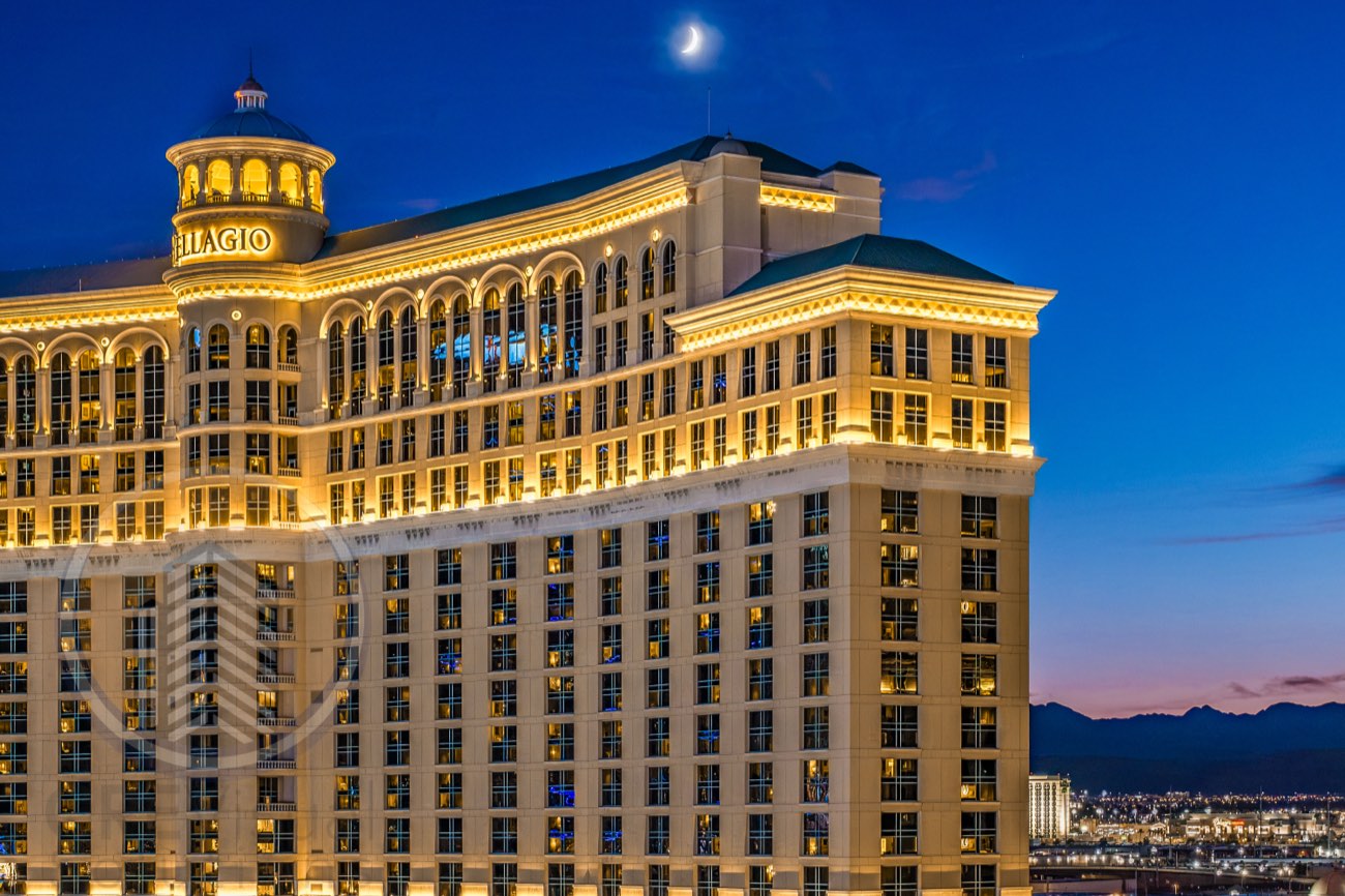 Bellagio at sunset with the moon behind it — Las Vegas Strip