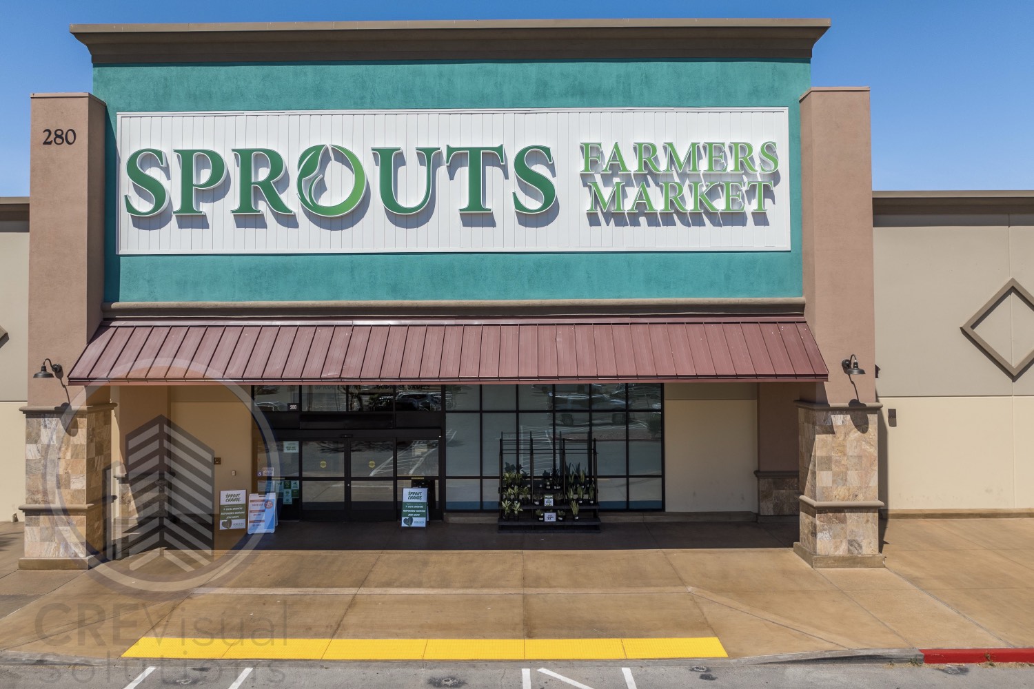 Grocery-anchored retail storefront entrance — Las Vegas